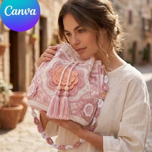 May include: A handmade, pink and white crochet bag with floral and geometric patterns. The bag features a drawstring closure, tassels, and a decorative strap. The Canva logo is visible in the upper left corner.