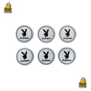 May include: Six white circular patches with a black bunny logo and the word "PLAYBOY" in black text. Each patch has a black stitched border. The patches are arranged in two rows of three.