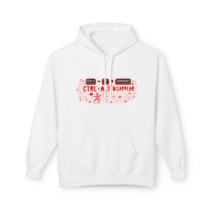 May include: White hoodie with a front pocket and a drawstring hood. The design features red text and graphics that read "CTRL + A to DISAPPEAR". The design includes a small stick figure and other decorative elements.