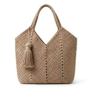 May include: A beige crochet tote bag with a chevron pattern. The bag has two handles and a decorative tassel. The bag is approximately 14 inches wide and 12 inches tall.