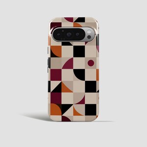 May include: A smartphone case featuring a geometric pattern of squares, triangles, and circles in a colour palette of black, deep red, burnt orange, and beige. The case has a horizontal cutout at the top for a camera module with three lenses.