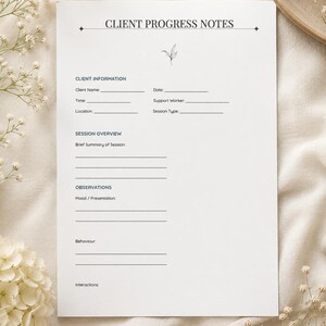 May include: A white paper form titled CLIENT PROGRESS NOTES with black text and a small botanical line drawing. The form includes sections for Client Information, Session Overview, and Observations, with blank lines for writing details.