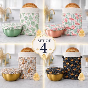 May include: A set of four beeswax-infused fabric bowl covers and matching drawstring storage bags. The patterns include green cacti with hearts, pink flamingos, woodland foxes, and sloths on a dark blue background, paired with metal bowls.