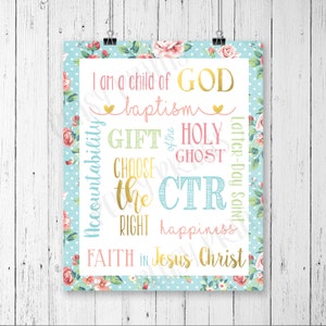 May include: A framed print with a white background and various colourful text elements. The text includes phrases like "I am a child of GOD", "baptism", and "Choose the Right". The print is bordered with a floral and polka dot pattern.