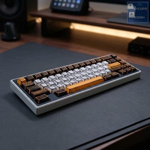 May include: A mechanical keyboard with a white and orange keycap design. The keycaps have black lettering and symbols. The keyboard sits on a dark gray surface. The keyboard has a gray frame.