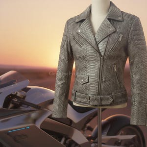 May include: A grey snakeskin-textured motorcycle jacket featuring a notched lapel, an asymmetrical front zip, multiple zipped pockets, a small flap pocket with a snap button, and a buckled belt at the waist. The text GenuinePythonJacket is visible.