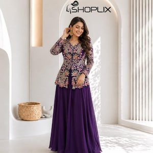 May include: A deep purple floor-length dress featuring a long-sleeved jacket overlay with intricate floral and paisley embroidery in shades of pink, orange, and white. The garment includes a solid purple skirt and the text SHOPLIX at the top.