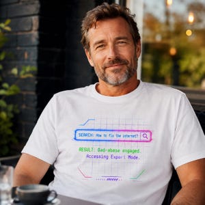 May include: White t-shirt with a humorous graphic. The graphic simulates a search engine query: "SEARCH: How to fix the internet?" with the result "Dad-abase engaged. Accessing Expert Mode."