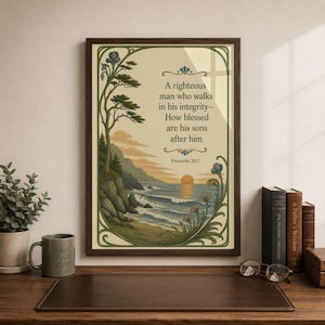 May include: Framed art print featuring a coastal landscape with a sunset and text from Proverbs 20:7. The artwork is in a dark wooden frame and includes decorative floral elements. A mug with "BEST DAD EVER" is visible.