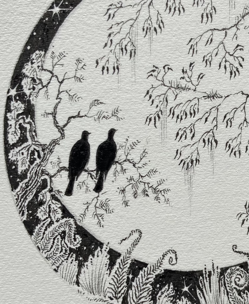 May include: A black and white ink drawing of two birds perched on a branch within a crescent moon shape. The moon is surrounded by a starry sky and a forest of trees.
