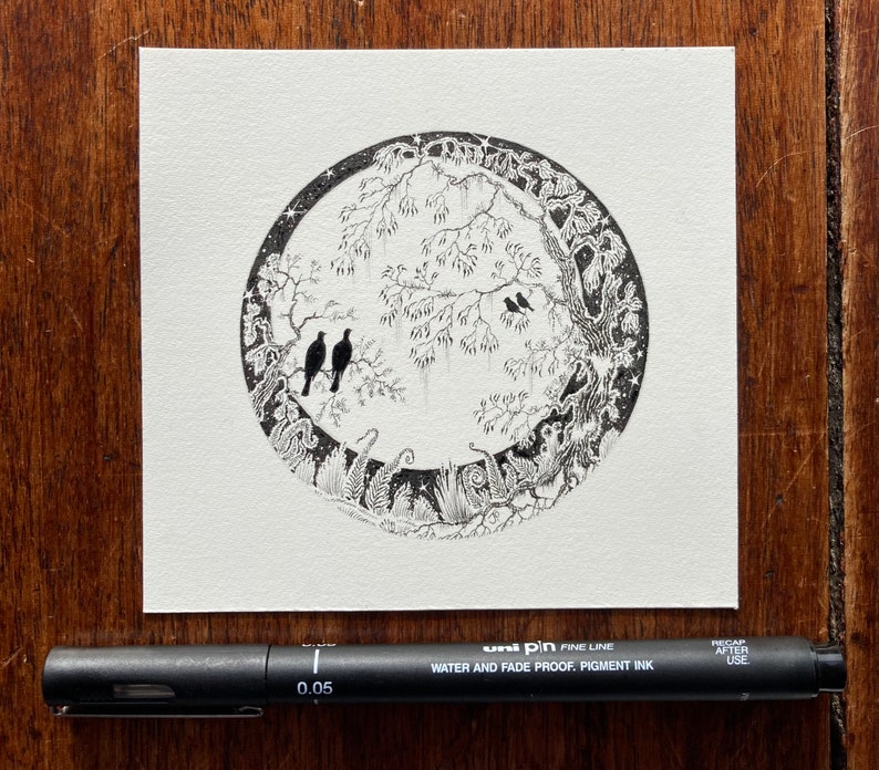 May include: Black and white ink drawing of a circular forest scene with birds, trees, and foliage. The drawing is done in a detailed, intricate style.
