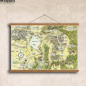 May include: A hanging canvas wall art piece featuring a detailed, illustrated map titled Map of Beatrix Potter's World. The map displays various green landscapes, winding paths, and labelled locations in a vintage, hand-drawn style with wooden rails.