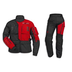 May include: A red and black motorcycle jacket and matching trousers set. The jacket features a high collar, multiple zipped pockets, and the Ducati logo on the chest. The trousers are black with red accents on the thighs and include zipped pockets.