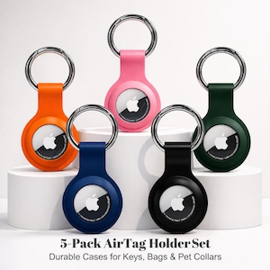 May include: A 5-pack AirTag holder set featuring silicone cases in orange, pink, dark green, blue, and black. Each circular holder includes a silver metal keyring attachment and displays an Apple AirTag with the white Apple logo visible.