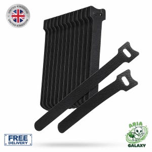 May include: A set of black hook and loop cable ties featuring a textured surface and a slotted head design. The collection includes several stacked ties alongside two individual ties positioned diagonally in front of the main stack.