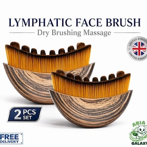May include: A set of two crescent-shaped lymphatic face brushes with dark wood-grain handles and dense, golden-brown bristles. The text reads LYMPHATIC FACE BRUSH, Dry Brushing Massage, 2 PCS SET, and FREE DELIVERY, with a United Kingdom flag icon.