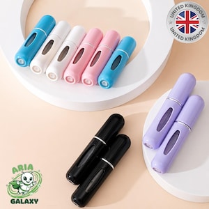 May include: A selection of refillable perfume atomisers in shades of blue, white, pink, and black. The atomisers have a streamlined, cylindrical design with a silver accent and a viewing window. The image also includes a United Kingdom logo.