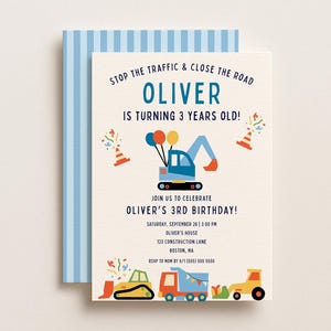 May include: A cream-colored birthday invitation card featuring blue, yellow, and red construction vehicle illustrations, including an excavator and dump truck, with text reading STOP THE TRAFFIC & CLOSE THE ROAD OLIVER IS TURNING 3 YEARS OLD.