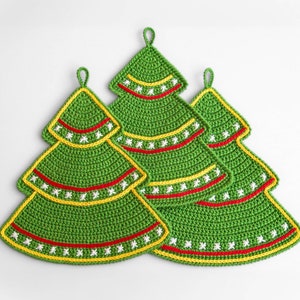 May include: Three green crocheted Christmas tree decorations with red and yellow trim and white snowflake designs.