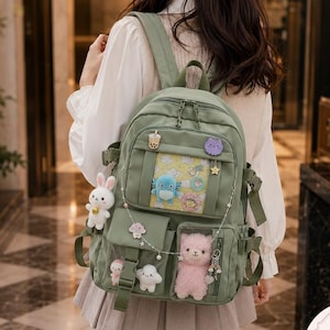 Ita Rucksack mit Plüsch Display Tasche und Pin Fenster