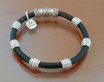 leather bracelet and silver unique design safe closure easy to wear it great for everyone