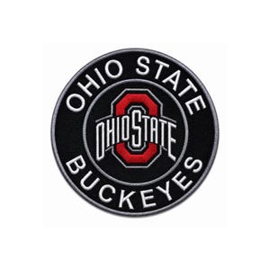 May include: A circular embroidered patch featuring a black background with a white border. The text OHIO STATE BUCKEYES is stitched in white around the perimeter. A central red and white block O logo with the text OHIO STATE is centred.