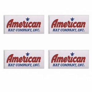 May include: Four rectangular white labels with the text "American HAT COMPANY, INC." in red and blue. The word "American" is in a bold, cursive font, with a blue star above it.