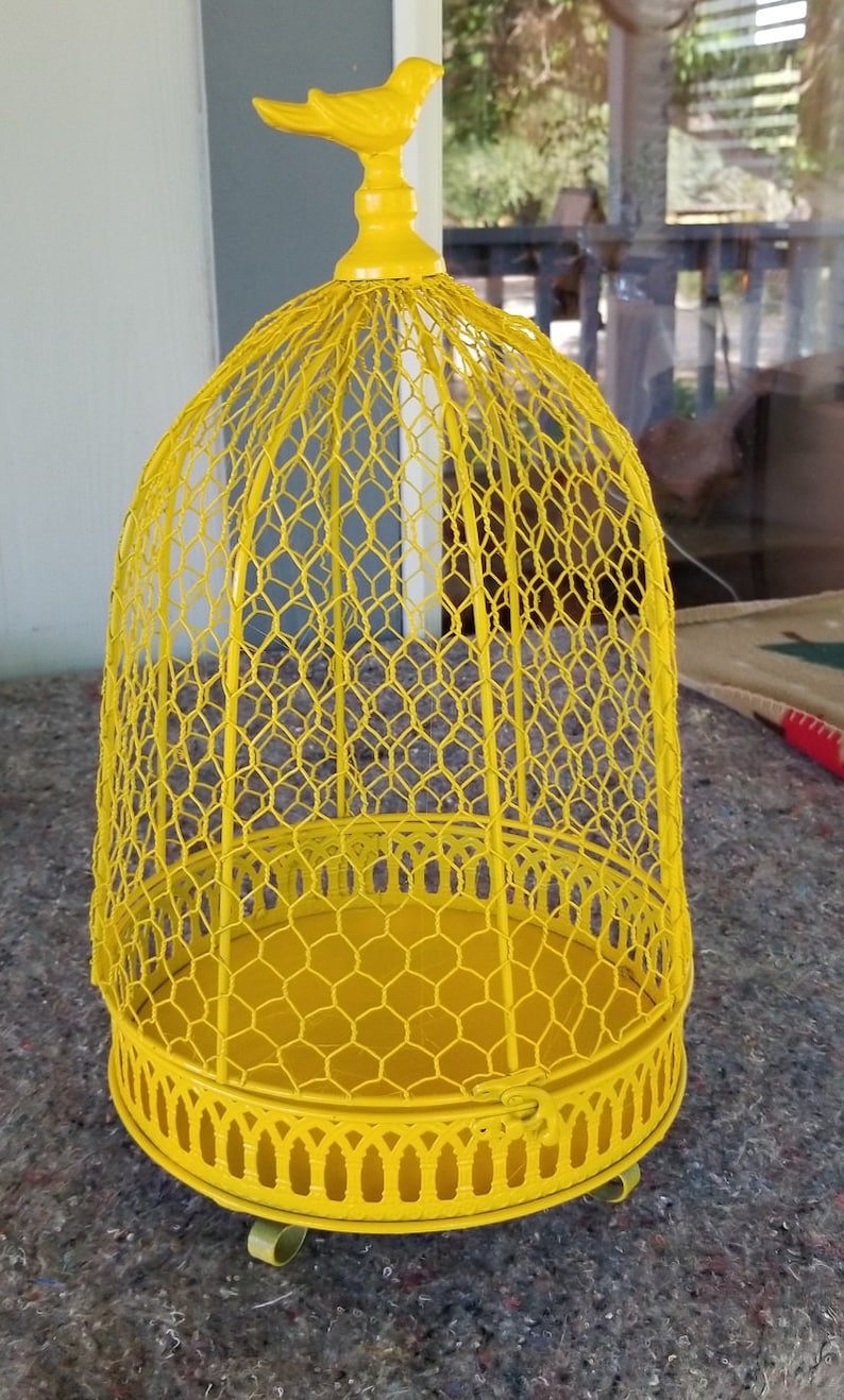 Bright yellow repainted vintage dome bird cage