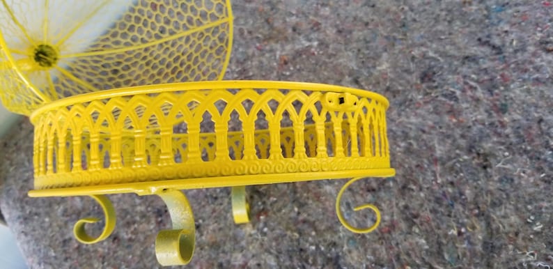 Bright yellow repainted vintage dome bird cage