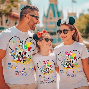 May include: Three white t-shirts featuring a large Mickey Mouse silhouette outline filled with colorful cartoon characters, including Mickey, Minnie, Donald, and Goofy. The text reads Family Vacation 2020, with Dad and Birthday Girl labels.