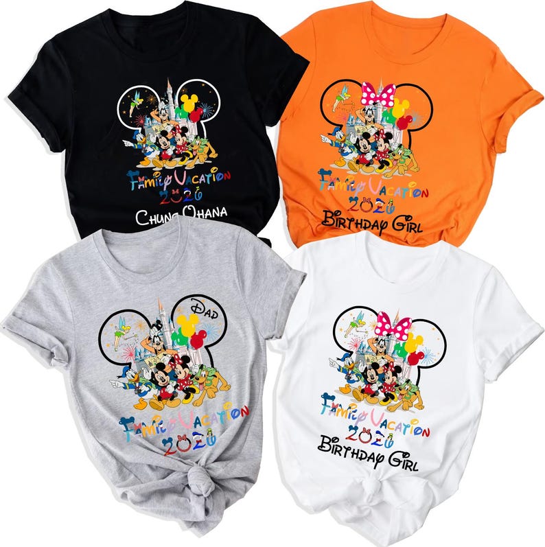 May include: Four short-sleeve t-shirts in black, orange, gray, and white. Each features a graphic of Disney characters inside a Mickey Mouse silhouette, a castle, and the text "FAMILY VACATION 2026". Specific shirts include "CHUNG OHANA", "DAD", and "BIRTHDAY GIRL".