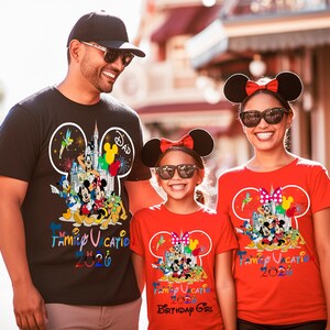 May include: A black t-shirt with a Mickey Mouse silhouette graphic containing Disney characters and the text Family Vacation 2026, and two red t-shirts with similar graphics, one featuring the additional text Birthday Girl below the main design.