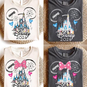 May include: Four t-shirts in cream and dark gray featuring a graphic of a castle, fireworks, and Mickey Mouse ears. Two shirts show blue balloons and two show a pink polka-dot bow with pink balloons. Each includes the text Disney 2026 and Name.