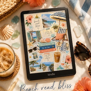 May include: A black e-reader displaying a collage of beach-themed stickers including a striped umbrella, a stack of books labeled Beach Reads, By the Sea, and Summer Stories, tropical flowers, seashells, and text reading beach read bliss.