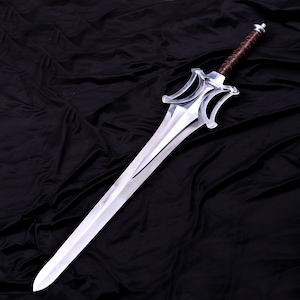 May include: A silver sword with a polished blade and a brown leather-wrapped handle. The sword features a distinctive hilt design with two curved, symmetrical elements. The blade is long and tapers to a sharp point.