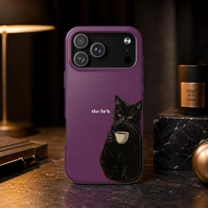 May include: A deep purple smartphone case featuring a graphic of a black cat holding a small white coffee cup. The text "the fu*k" is printed in white letters next to the cat. The case has a rectangular camera cutout with three circular lenses.