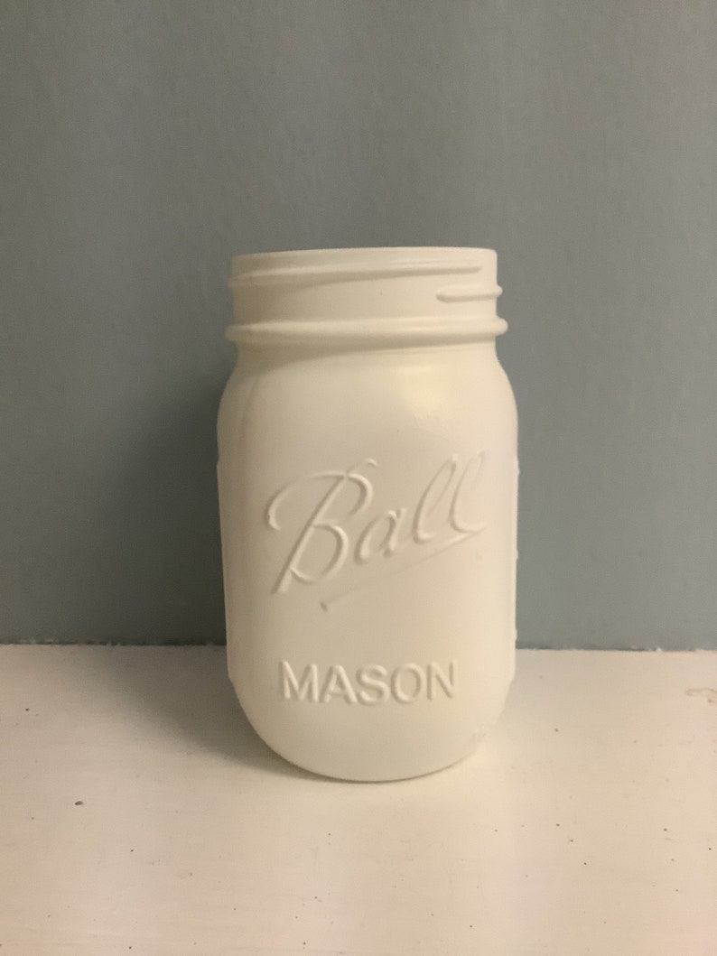 May include: White painted Ball Mason jar with the brand name and "MASON" embossed on the front.