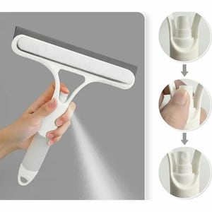 May include: A white and gray window cleaning tool with a spray function. The tool has a rectangular squeegee and a handle with a spray nozzle. The image shows the tool in use, spraying a fine mist. The tool is designed for cleaning windows and other surfaces.