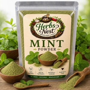 May include: A clear plastic pouch filled with green mint powder, featuring a label with the text Herbs Nest Mint Powder, illustrations of mint leaves, a bird in a nest, and four circular icons labeled 100% Natural, Rich in Nutrients, Naturally Cooling, and Made with Love.
