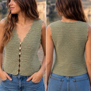 May include: A sage green crochet top with a scalloped neckline and button closure. The sleeveless top is paired with blue jeans. The image shows the front and back of the top.