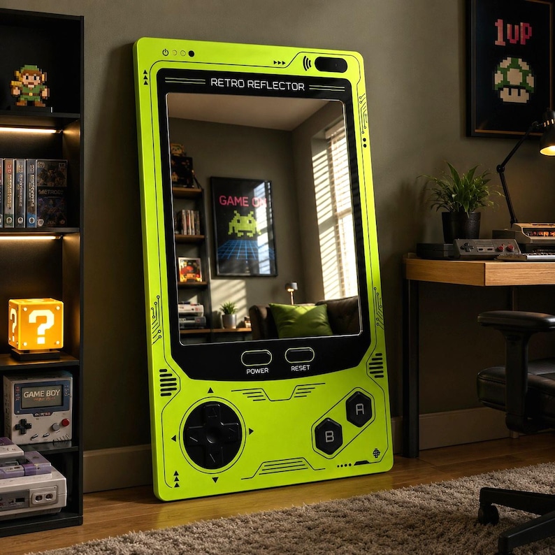 May include: A lime green rectangular floor mirror designed to resemble a vintage handheld gaming console. The frame features black button graphics, a directional pad, and the text RETRO REFLECTOR, POWER, and RESET printed on the front surface.