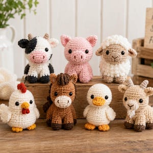 May include: A collection of seven small crochet farm animal figures including a black and white cow, a pink pig, a white sheep, a white chicken with a red comb, a brown horse, a white duck, and a tan goat with a small beard and horns.