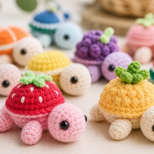 May include: A collection of colorful crochet turtles, each designed to resemble different fruits. The turtles feature details like a strawberry, kiwi, orange, and watermelon, with black button eyes and cream-colored bodies.