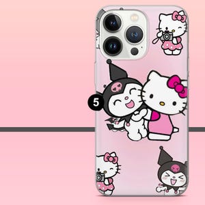 Peut inclure: Coque de t&eacute;l&eacute;phone transparente avec un fond rose d&eacute;grad&eacute; repr&eacute;sentant des personnages de dessins anim&eacute;s. La coque pr&eacute;sente un motif Hello Kitty et Kuromi, avec Hello Kitty portant un n&oelig;ud rose et Kuromi portant un chapeau noir.