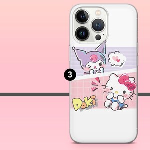 Peut inclure: Coque de t&eacute;l&eacute;phone blanche avec les personnages de dessins anim&eacute;s Kuromi et Hello Kitty. L'&eacute;tui a un fond rose et violet avec le mot "Doki". L'&eacute;tui est con&ccedil;u pour un smartphone.