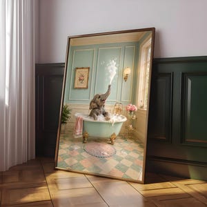 May include: A framed rectangular wall art print featuring a baby elephant sitting in a light green clawfoot bathtub filled with bubbles. The elephant is blowing a stream of bubbles from its trunk. The bathroom has light green walls and checkered floors.