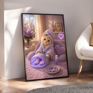 May include: A framed wall art print featuring a light orange cat wearing a lavender bathrobe and matching head towel. The cat sits in a plush chair with a purple UV nail lamp, a bottle of nail polish, and a small dish of beaded bracelets nearby.