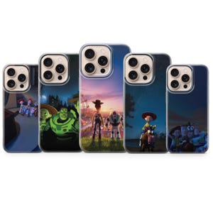 May include: Five clear phone cases with colorful graphics featuring characters from the animated movie Toy Story. The cases display images of Woody, Buzz Lightyear, and other characters against various backgrounds.