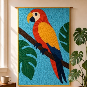 May include: A rectangular wall hanging quilt featuring a vibrant red, yellow, and blue macaw parrot perched on a brown branch. The background is a textured light blue fabric with large green monstera leaves. The quilt has a yellow border and rod.