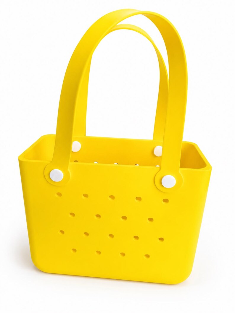 May include: Bright yellow tote bag with two curved handles and a rectangular body. The bag features small, evenly spaced holes and is secured with white circular fasteners. The bag is made of a flexible material.